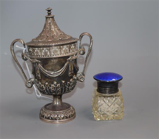 A silver urn and cover, swag and acanthus decoration, London 1935, D & J Welby (a.f.) and a silver and enamel-topped toilet bottle